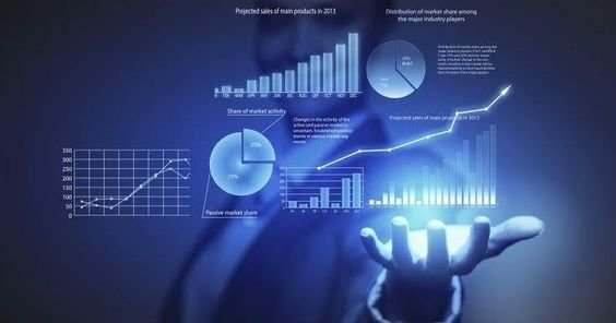 Person typing on laptop with graphs and diagrams, illustrating journey from startup to success.
